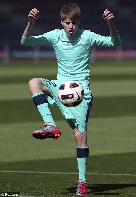 justin bieber playing soccer barcelona. So I guess Justin Bieber can